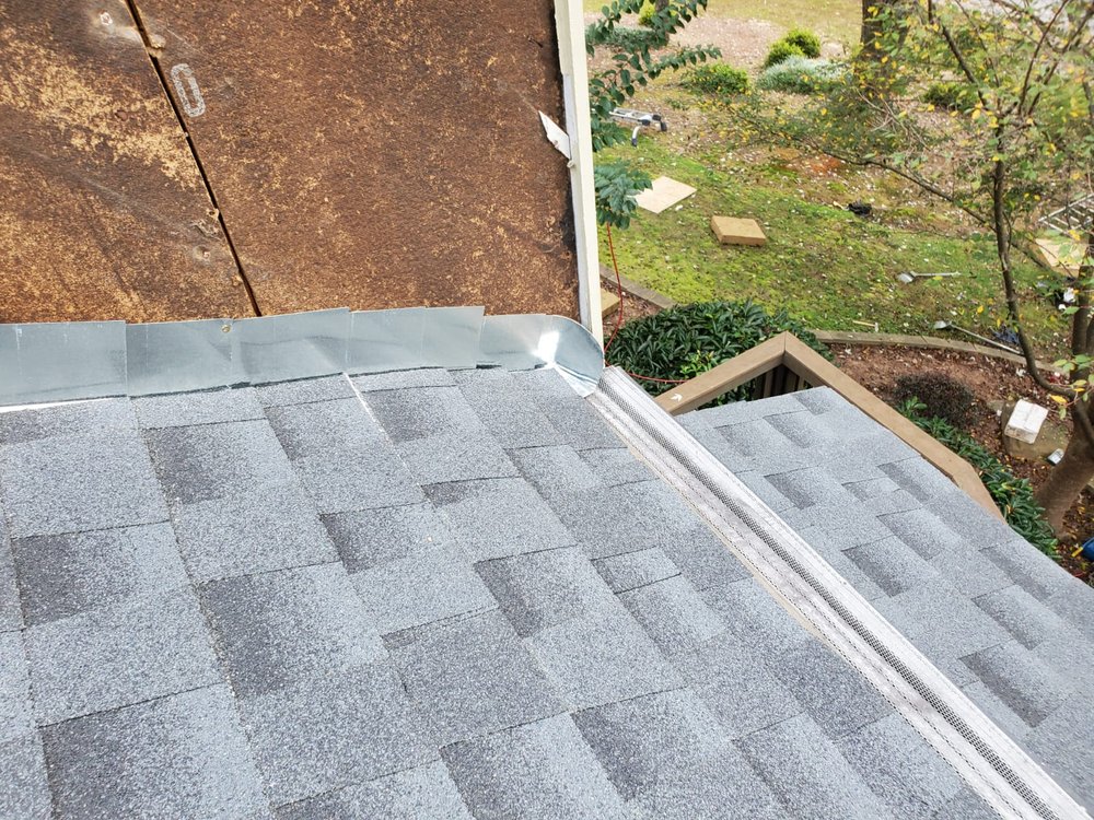 Slide of DOM Roofing & Restoration