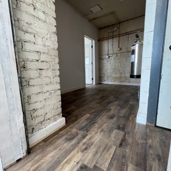 M&J Contracting Services - an empty room with wood floors - General Contractors Near Me M&J Contracting Services - an empty room with wood floors - General Contractors Near Me