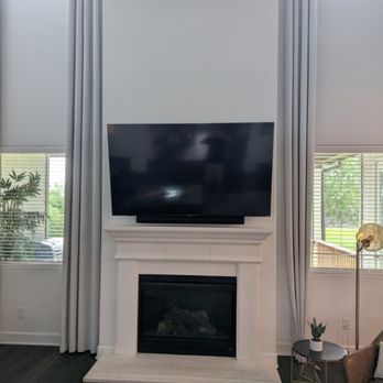 D Lowell Home Maintenance - Mounted "65 inch TV above the mantle. Hanged floor to ceiling drapes. 

Mountings and hangings made possible by
D. Lowell Home Maintenance. - Handyman Near Me - New Braunfels, Texas