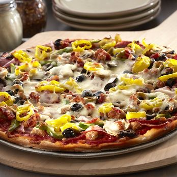 Carbones Pizzeria - a pizza on a wooden board - Pizza Near Me - Edina, Minnesota Carbones Pizzeria - a pizza on a wooden board - Pizza Near Me - Edina, Minnesota