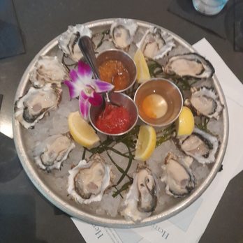 Herringbone Waikiki - 4 orders of wildcard oysters. Our favorite was the cocktail sauce (seen in the vibrant red sauce). - Seafood Near Me - Honolulu, Hawaii