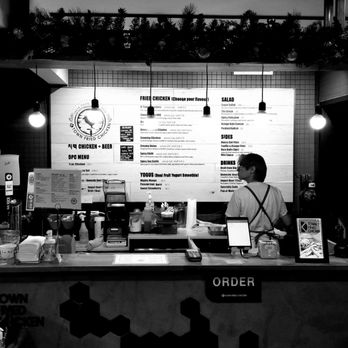 K Town Fried Chicken - a man behind the counter - Korean Near Me - Calgary, Alberta