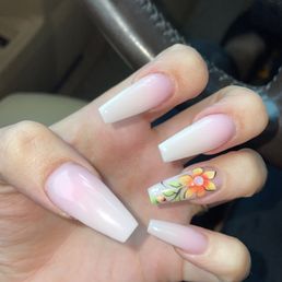 Ombré pink and white nails with flower.