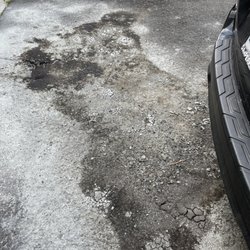Bruneau's Garage - Ruined asphalt driveway after spillage due to their negligence!!