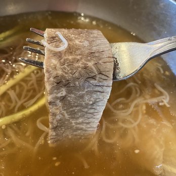 Tang 190 - Overcooked beef brisket in the cold noodle. There was only 2 slices of this. - Korean Near Me - Irvine, California Tang 190 - Overcooked beef brisket in the cold noodle. There was only 2 slices of this. - Korean Near Me - Irvine, California