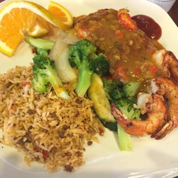 Texas Seafood & Steakhouse - King Salmon with crawfish étouffée, veggies and rice. - Seafood Near Me - Somerville, Texas