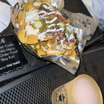 Bayou Beer Garden - Nachos with ground beef; watermelon margarita - Beer Gardens Near Me - New Orleans, Louisiana