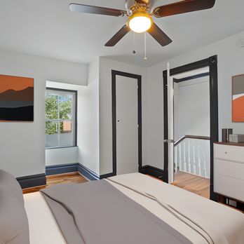 Top Notch Contractors - a bedroom with a ceiling fan - General Contractors Near Me