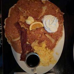 Banana brown sugar pancake with scrambled eggs and bacon. Banana brown sugar pancake with scrambled eggs and bacon.