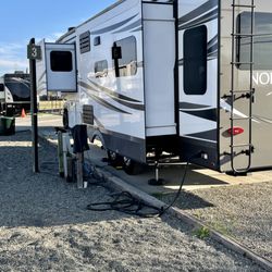 NAS Lemoore RV Park & Campground - Each pull thru has full 50/30 amp, water, waist and cable.