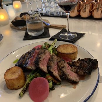 Bluebird Kitchen - Aged NY Strip (medium-rare) with grilled caulilini, crispy cooked potatoes, pickled radish & mint salsa verde - Cocktail Bars Near Me - Bellmore, New York