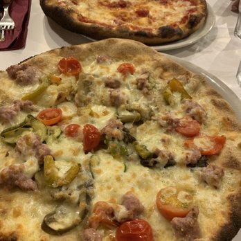 Dar Poeta - Pepperoni in the background and sausage/veggie in the foreground - Pizza Near Me - Rome, RM