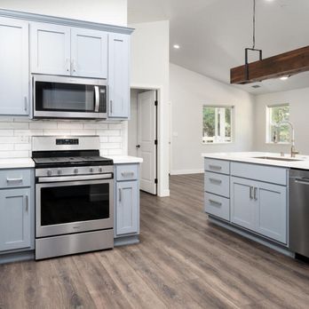 Get Construction - Spacious Open Plan Kitchen. Custom reclaimed wood (from previous home) light fixture over large island - General Contractors Near Me Get Construction - Spacious Open Plan Kitchen. Custom reclaimed wood (from previous home) light fixture over large island - General Contractors Near Me