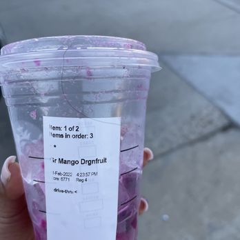 Starbucks - a hand holding a plastic cup with a purple drink in it - Coffee & Tea Near Me - Fillmore, California Starbucks - a hand holding a plastic cup with a purple drink in it - Coffee & Tea Near Me - Fillmore, California