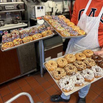 Donut Time - a man holding trays of doughnuts - Donuts Near Me - El Cerrito, California