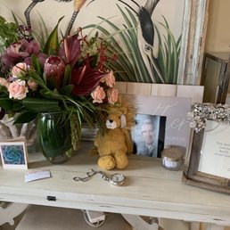Exquisite flower arrangement and the softest Jellycat stuffed animal for the grandson.