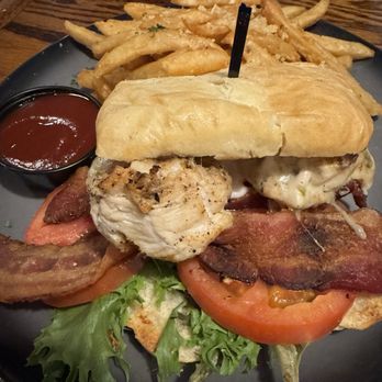 Murphy's Restaurant - 10'25 - Cortez Street Chicken & Side - A chicken sandwich with grilled chicken, bacon, lettuce, and tomato on a bun, accompanied by French fries and a side of ketchup. - Seafood Near Me - Prescott, Arizona