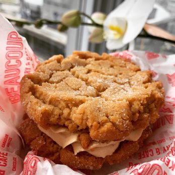 Beaucoup Bakery & Cafe - Peanut butter cookie sandwich with raspberry currant jam center. Gluten-free. - Bakeries Near Me - Vancouver, British Columbia