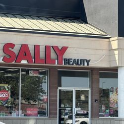 Sally Beauty - front of store they stood there until i sat in my car for a while