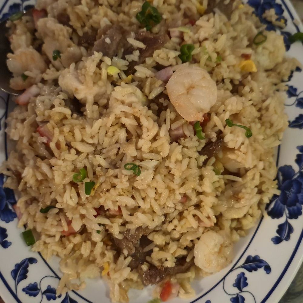 Young rice included beef, chicken and shrimp. It was good. Young rice included beef, chicken and shrimp. It was good.