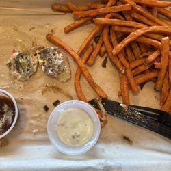 The Boardwalk - What's left of my hamburger with jalapenos and sweet potato fries with ranch and bbq sauce