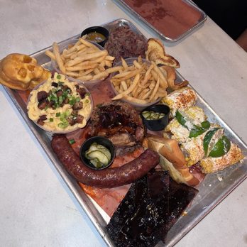 Apocalypse BBQ - Off Menu BBQ Platter: Chopped brisket, sausage, smoked ribs, pulled pork, elote, mac n cheese, corn bread skulls, and buttered toasted - Food Trucks Near Me - Miami, Florida