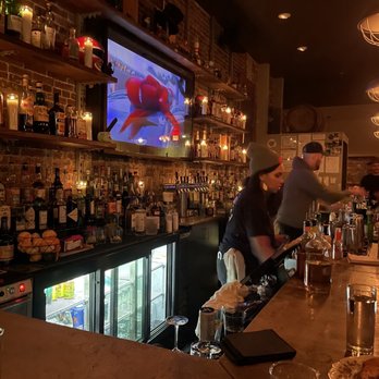 Jm Curley - a man and a woman at a bar - New American Near Me - Boston, Massachusetts Jm Curley - a man and a woman at a bar - New American Near Me - Boston, Massachusetts
