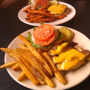 Joe's Friendly Tavern - Burgers with regular and sweet potato fries. - American Near Me - Empire, Michigan Joe's Friendly Tavern - Burgers with regular and sweet potato fries. - American Near Me - Empire, Michigan
