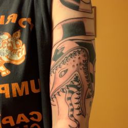 Black Pearl Tattoo Studio & Gallery - Chris' beetlejuice sandworm arm band