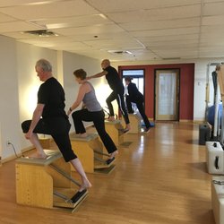 Core Wisdom - Pilates Low Chair Class. Great for improving balance and overall strength. Perfect ski conditioning and off season bike cross training.