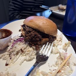 Grossly over roasted pulled pork sandwich.