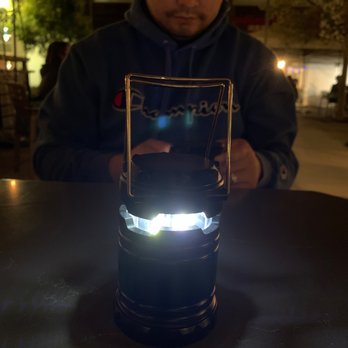 Pineapple Thai - They give you a cute light. My handsome husband in the back. - Thai Near Me - Cupertino, California