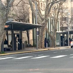 Sacramento Regional Transit District - Comparison #2: Long-view South along block from 7th & L towards 7th & Capitol Sts. -awning, disabled ramp, AND "Connect"-machines.