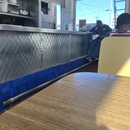 A view of the stainless steel counter and some booths A view of the stainless steel counter and some booths