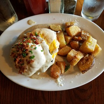 The Tavern - Brunch serving of the sausage, egg, and cheese biscuit with breakfast potatoes - American Near Me - Tulsa, Oklahoma The Tavern - Brunch serving of the sausage, egg, and cheese biscuit with breakfast potatoes - American Near Me - Tulsa, Oklahoma