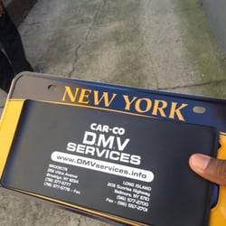 Car Co DMV Services - A customer getting his plates. Note that our address has changed to 2596 Sunrise Highway.