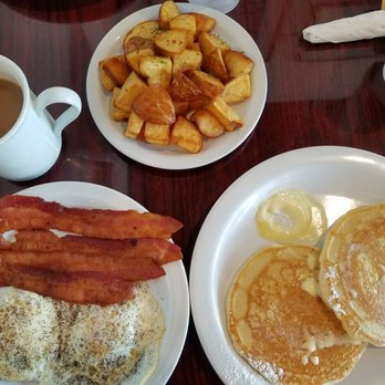Shelly's Cafe - Buttermilk pancakes combo with eggs and bacon plus an order of home fries. - Breakfast & Brunch Near Me - Tampa, Florida