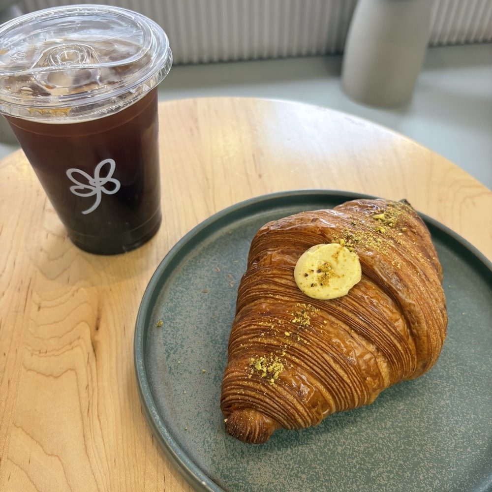Slow Bite Bakery - Pistachio Croissant and iced americano - Bakeries Near Me - Toronto, Ontario Slow Bite Bakery - Pistachio Croissant and iced americano - Bakeries Near Me - Toronto, Ontario