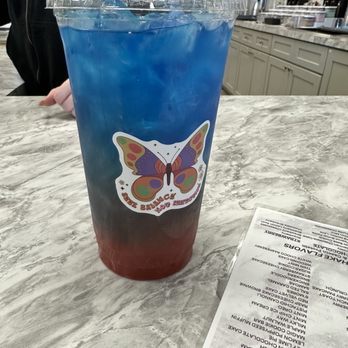 Nutrition Wave - a blue drink with a butterfly sticker on it - Juice Bars & Smoothies Near Me - Cicero, New York Nutrition Wave - a blue drink with a butterfly sticker on it - Juice Bars & Smoothies Near Me - Cicero, New York