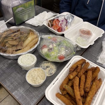 Greek Cove - Gyro platter with lemon potatoes, Greek side salad, gyro sandwich & zucchini sticks appetizer. - Greek Near Me - Merrick, New York Greek Cove - Gyro platter with lemon potatoes, Greek side salad, gyro sandwich & zucchini sticks appetizer. - Greek Near Me - Merrick, New York