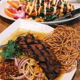 Khao Soi (Thai Curry Noodle) and The Rainbow fish in the back Khao Soi (Thai Curry Noodle) and The Rainbow fish in the back