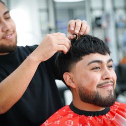 Texturing the top with hair powder ,look at this nice haircut .. schedule yours today