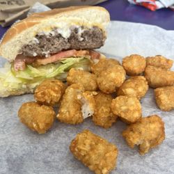 Griffin Grill - Cutaway view of a cheeseburger (dressed) and a half-order of tater tots.