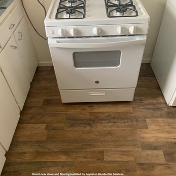 Appleton Residential Services - a white stove in a kitchen - Handyman Near Me