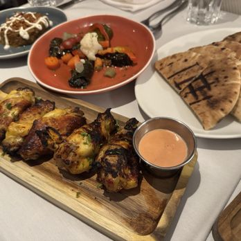 Shiraz Kitchen & Wine Bar - Shiraz Saffron Wings Dolmeh Kashke -Bademjoon - Persian/Iranian Near Me - New York, New York Shiraz Kitchen & Wine Bar - Shiraz Saffron Wings Dolmeh Kashke -Bademjoon - Persian/Iranian Near Me - New York, New York