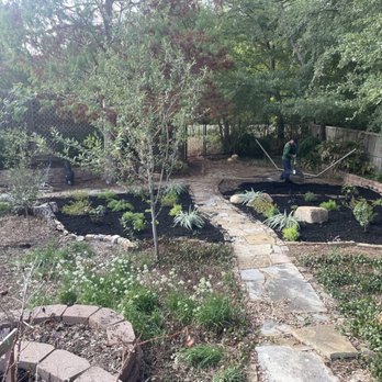 Grow Your Landscape - a man standing in the middle of a garden - Landscaping Near Me Grow Your Landscape - a man standing in the middle of a garden - Landscaping Near Me