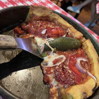 Gino's East - Magnificent Mile - Chicago Fire - Pizza Near Me - Chicago, Illinois Gino's East - Magnificent Mile - Chicago Fire - Pizza Near Me - Chicago, Illinois