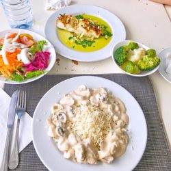 Atelier de Comida Restaurante - Top: bacalhau na brasa (charcoaled cod fish) 11.80 euros Bottom: bifinhos Peru (turkey with cream & mushroom over rice) 6.50 euros