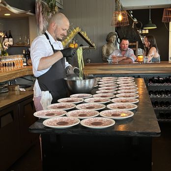 Ceraldi - a chef preparing food in a kitchen - Italian Near Me - Provincetown, Massachusetts Ceraldi - a chef preparing food in a kitchen - Italian Near Me - Provincetown, Massachusetts