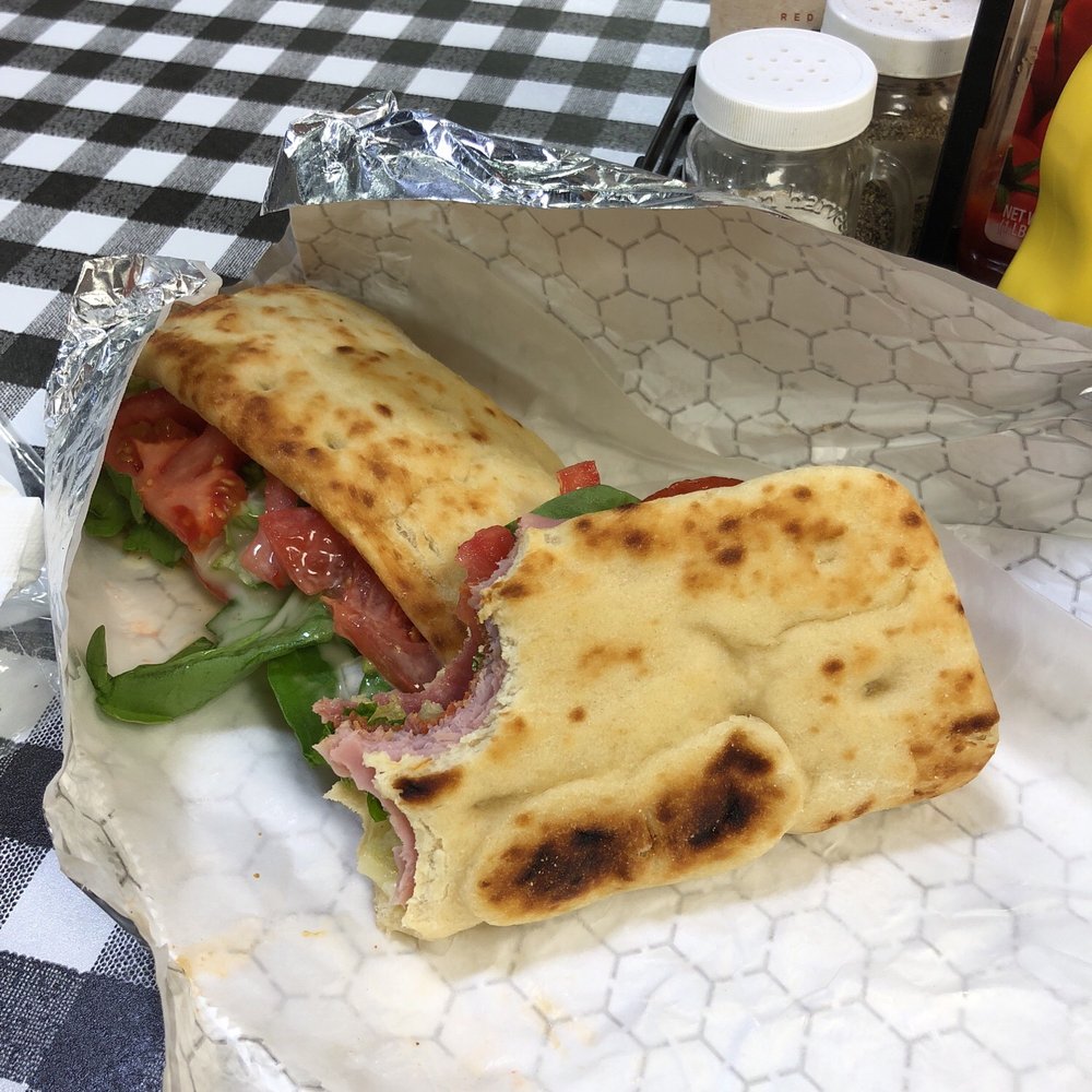 a sandwich wrapped in foil a sandwich wrapped in foil